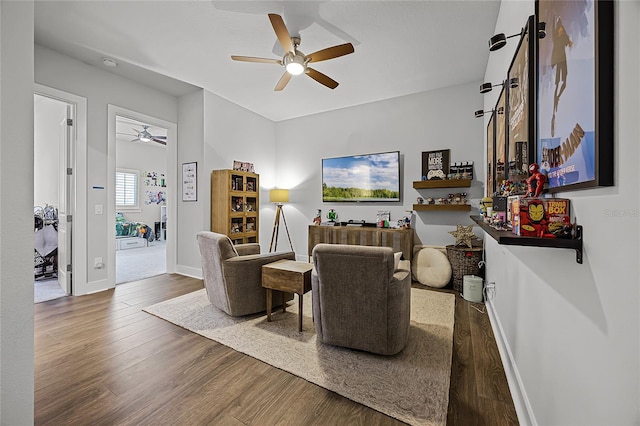 17290 Hickory Wind Dr, Clermont, FL 34711 - living area featuring ceiling fan and wood finished floors