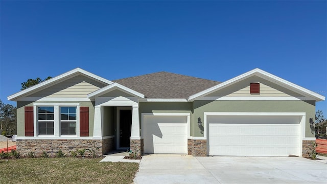 3305 Arch Ave, Ormond Beach, FL 32174 - craftsman inspired home with stone siding, a garage, driveway, a shingled roof, and stucco siding