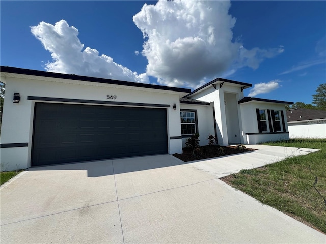 569 Marion Oaks Mnr, Ocala, FL 34473 - single story home with stucco siding, driveway, and an attached garage