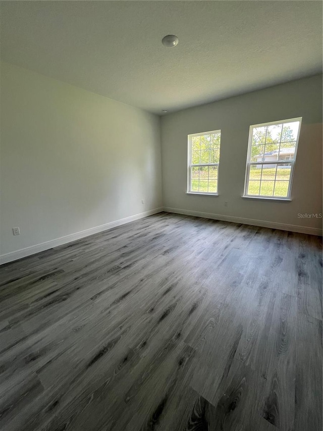 569 Marion Oaks Mnr, Ocala, FL 34473 - empty room featuring dark wood-style floors