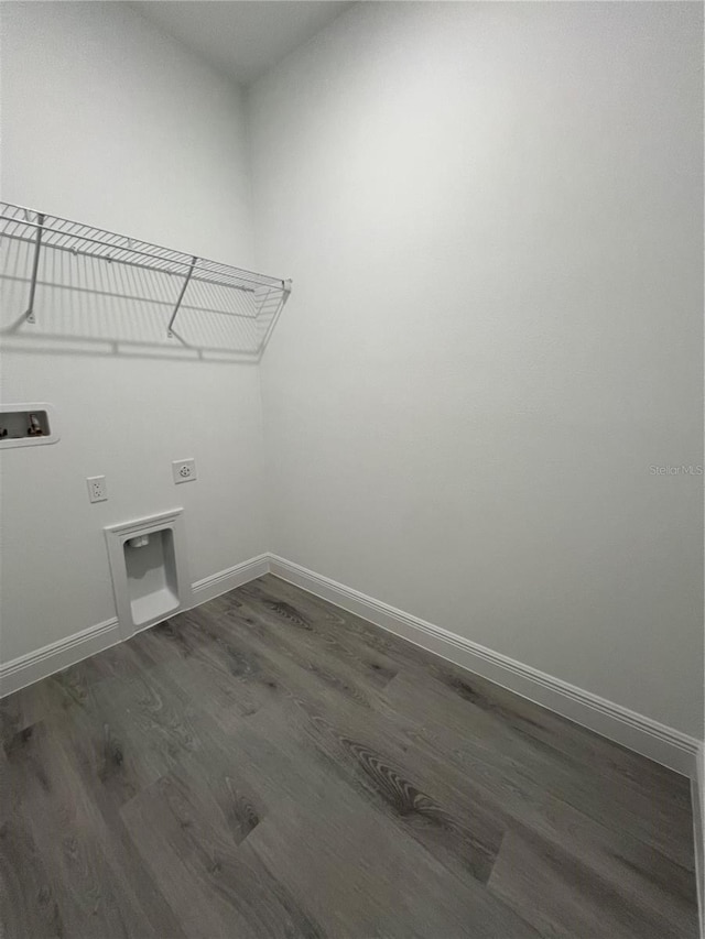 569 Marion Oaks Mnr, Ocala, FL 34473 - laundry room with hookup for a washing machine, dark wood-type flooring, and electric dryer hookup