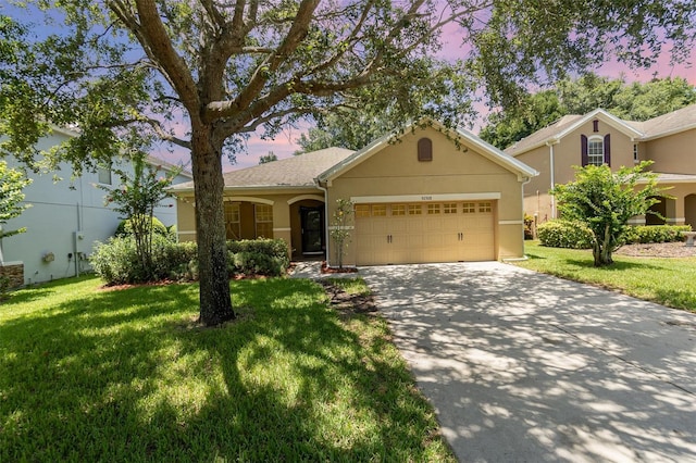 30308 Cheval St, Mount Dora, FL 32757 - single story home with stucco siding, a front lawn, a garage, and concrete driveway