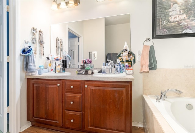 30308 Cheval St, Mount Dora, FL 32757 - full bathroom with double vanity, a garden tub, wood finished floors, and a chandelier