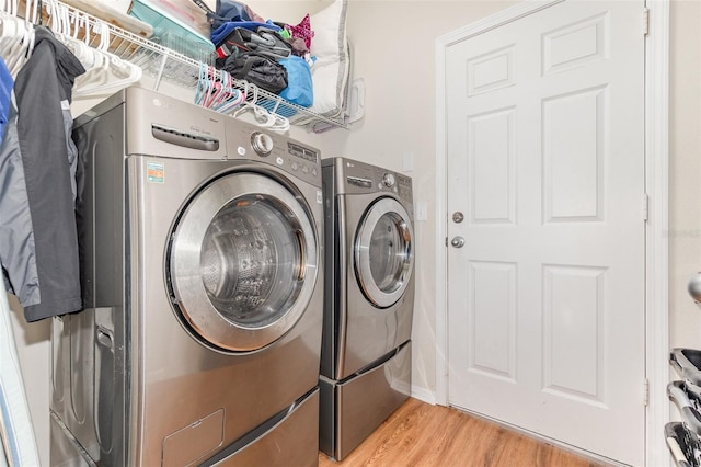 30308 Cheval St, Mount Dora, FL 32757 - washroom with washer and dryer and light wood-style flooring