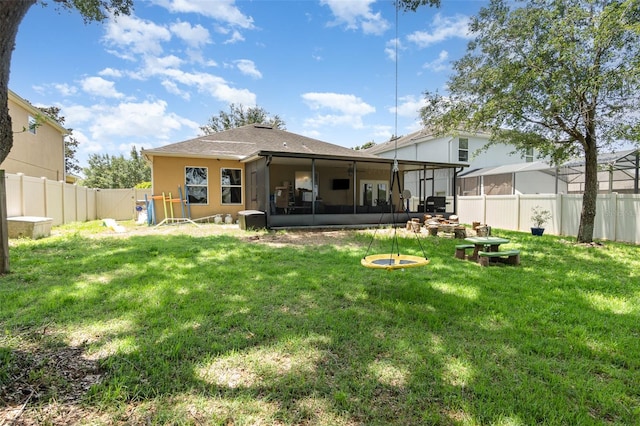 30308 Cheval St, Mount Dora, FL 32757 - back of property featuring a sunroom, a fenced backyard, and stucco siding