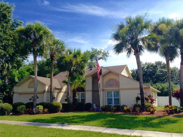 5704 Bay Side Dr, Orlando, FL 32819 - view of front facade featuring stucco siding and an attached garage