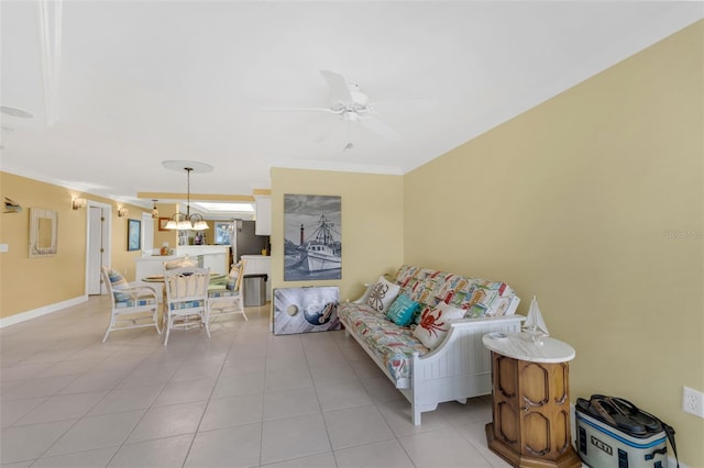 4631 S Atlantic Ave Unit 8102, Port Orange, FL 32127 - living room featuring ornamental molding, light tile patterned floors, ceiling fan, and a chandelier