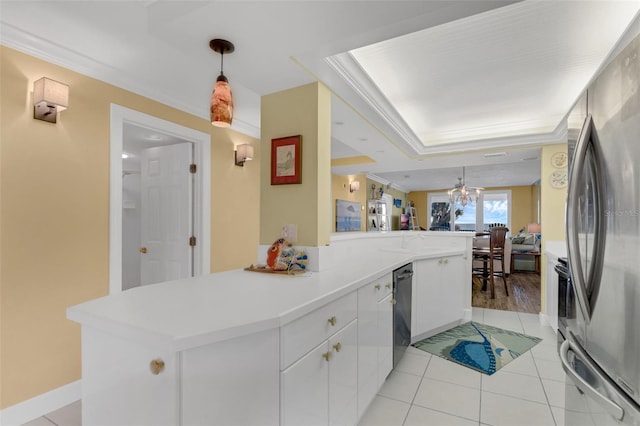 4631 S Atlantic Ave Unit 8102, Port Orange, FL 32127 - kitchen featuring stainless steel appliances, white cabinetry, light countertops, crown molding, and hanging light fixtures