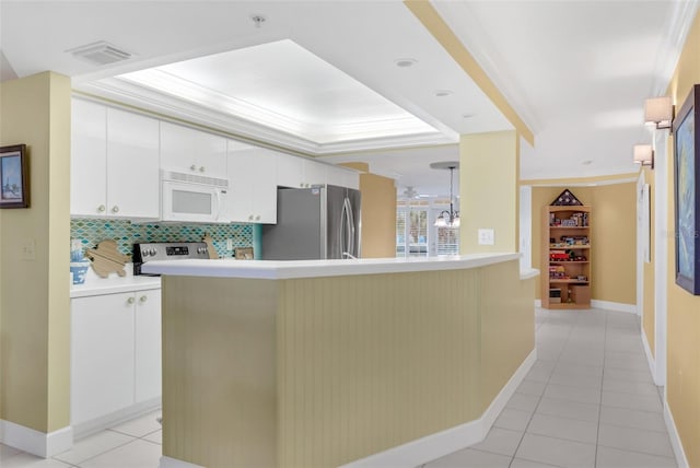 4631 S Atlantic Ave Unit 8102, Port Orange, FL 32127 - kitchen featuring appliances with stainless steel finishes, light tile patterned floors, light countertops, and ornamental molding