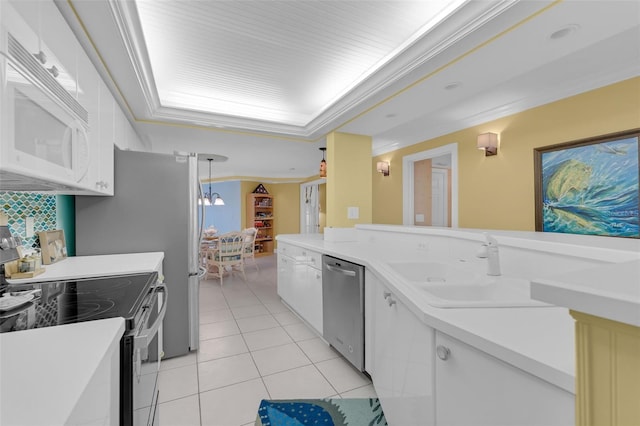 4631 S Atlantic Ave Unit 8102, Port Orange, FL 32127 - kitchen featuring appliances with stainless steel finishes, light tile patterned floors, decorative backsplash, light countertops, and a raised ceiling