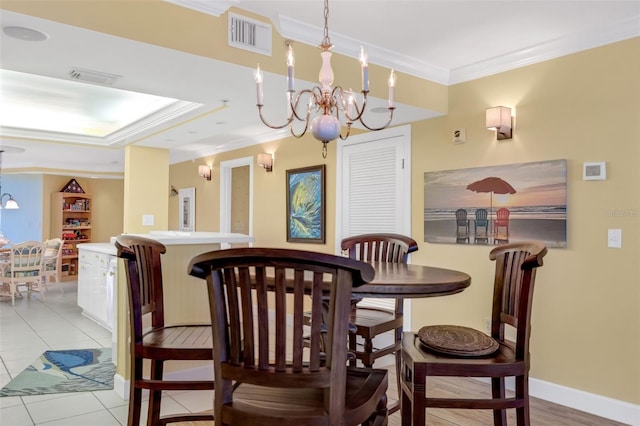 4631 S Atlantic Ave Unit 8102, Port Orange, FL 32127 - dining space featuring ornamental molding, a chandelier, and light tile patterned floors