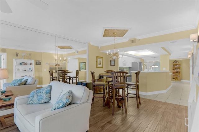 4631 S Atlantic Ave Unit 8102, Port Orange, FL 32127 - living room with crown molding, a chandelier, and light wood-style floors