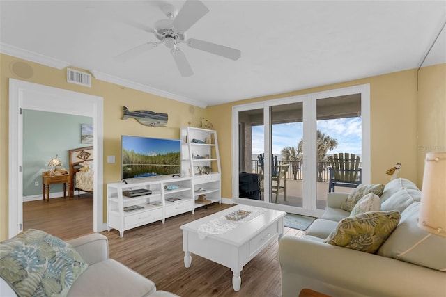 4631 S Atlantic Ave Unit 8102, Port Orange, FL 32127 - living area with wood finished floors, a ceiling fan, and crown molding