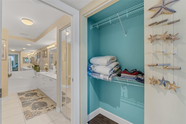 4631 S Atlantic Ave Unit 8102, Port Orange, FL 32127 - walk in closet with tile patterned flooring