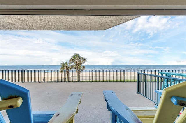 4631 S Atlantic Ave Unit 8102, Port Orange, FL 32127 - view of patio with view of water and beach