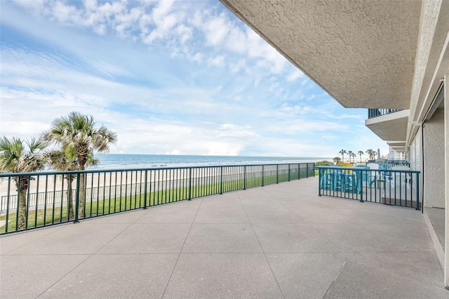 4631 S Atlantic Ave Unit 8102, Port Orange, FL 32127 - patio / terrace featuring view of water and beach