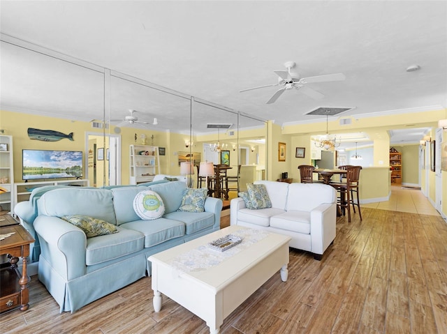 4631 S Atlantic Ave Unit 8102, Port Orange, FL 32127 - living room with a ceiling fan, ornamental molding, light wood-style flooring, and a chandelier