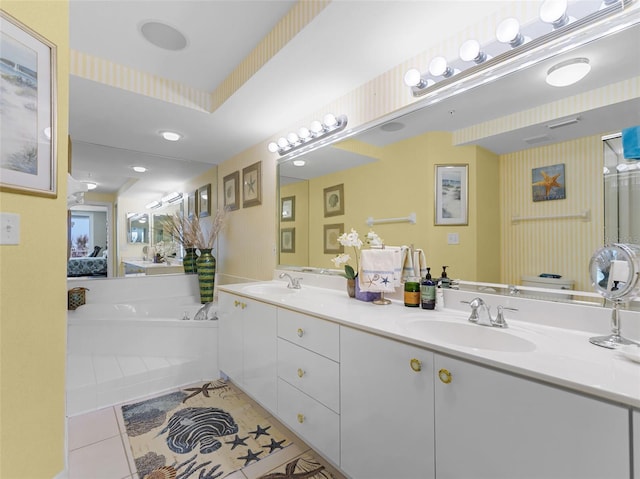 4631 S Atlantic Ave Unit 8102, Port Orange, FL 32127 - bathroom with double vanity, a garden tub, and tile patterned flooring