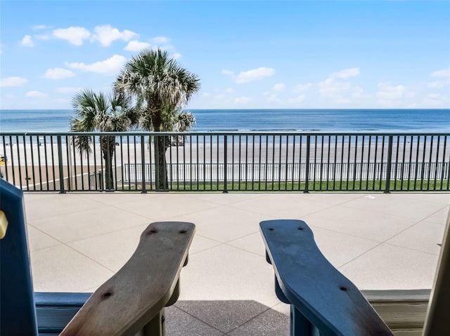 4631 S Atlantic Ave Unit 8102, Port Orange, FL 32127 - view of patio / terrace with view of water and beach