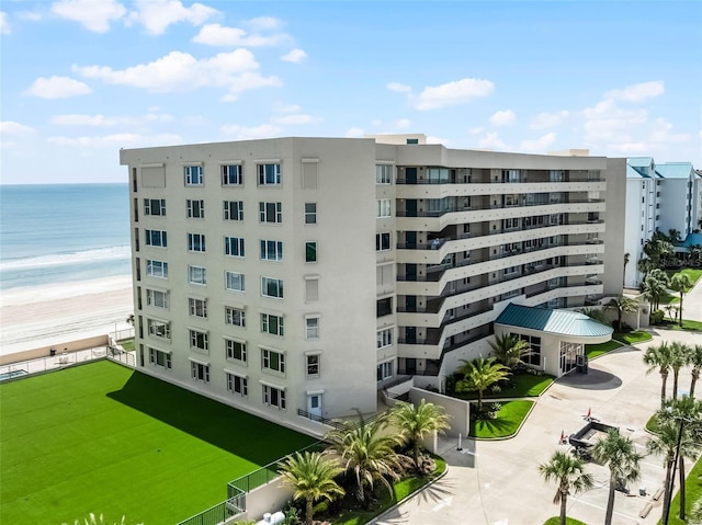 4631 S Atlantic Ave Unit 8102, Port Orange, FL 32127 - view of apartment building / complex with view of water and beach