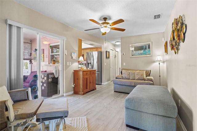 109 Woodfield Ct, Sanford, FL 32773 - living area with ceiling fan, light wood-type flooring, and a textured ceiling