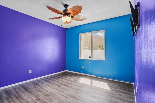109 Woodfield Ct, Sanford, FL 32773 - empty room featuring ceiling fan, wood finished floors, and a textured ceiling