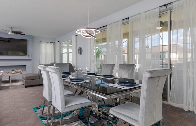 1811 Caribbean View Ter, Kissimmee, FL 34747 - dining room with tile patterned flooring and ceiling fan