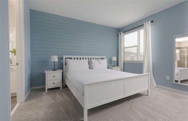 1811 Caribbean View Ter, Kissimmee, FL 34747 - bedroom featuring carpet floors, wood walls, and connected bathroom