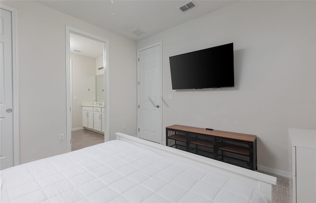 1811 Caribbean View Ter, Kissimmee, FL 34747 - bedroom with baseboards and ensuite bathroom