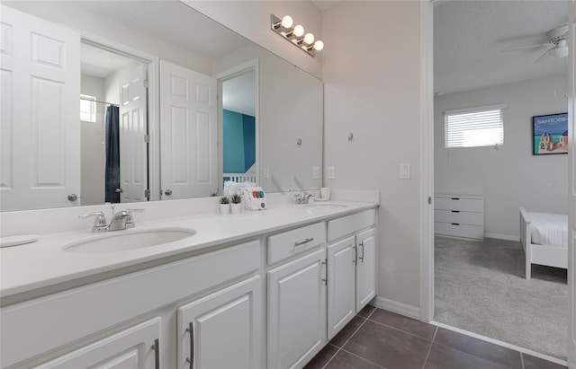 1811 Caribbean View Ter, Kissimmee, FL 34747 - full bath featuring double vanity, ceiling fan, connected bathroom, and tile patterned floors