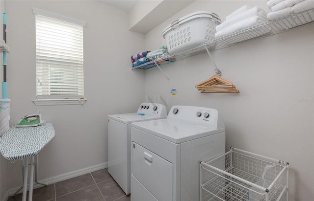 1811 Caribbean View Ter, Kissimmee, FL 34747 - laundry area with washer and dryer and dark tile patterned floors
