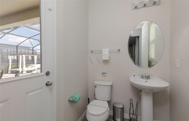 1811 Caribbean View Ter, Kissimmee, FL 34747 - bathroom featuring toilet and baseboards