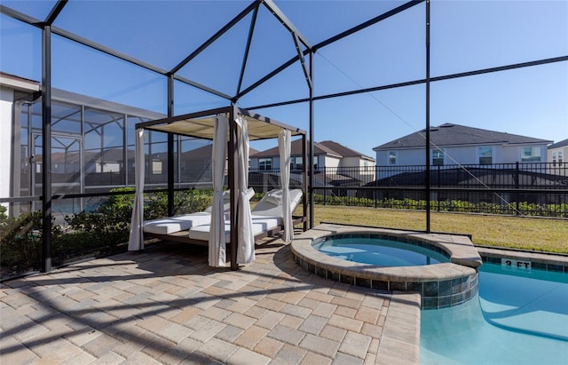 1811 Caribbean View Ter, Kissimmee, FL 34747 - view of pool featuring a lanai, a pool with connected hot tub, a residential view, and a patio