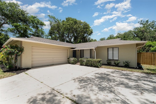 917 Great Bend Rd, Altamonte Springs, FL 32714 - view of front of home featuring stucco siding, a garage, and concrete driveway