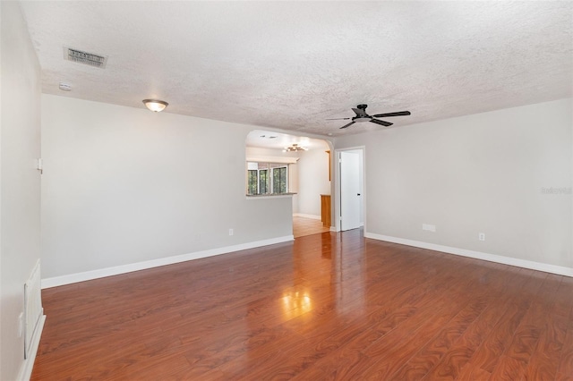 917 Great Bend Rd, Altamonte Springs, FL 32714 - spare room featuring a chandelier, a ceiling fan, a textured ceiling, and wood finished floors