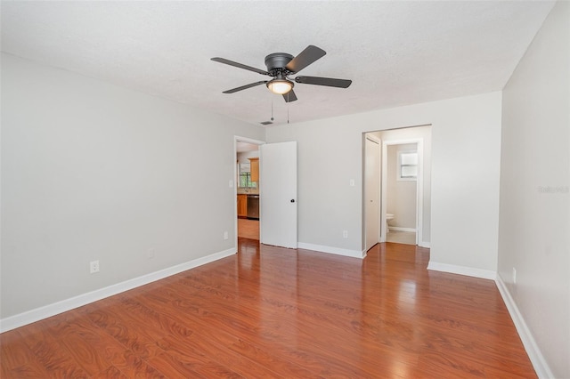 917 Great Bend Rd, Altamonte Springs, FL 32714 - unfurnished bedroom featuring wood finished floors, ensuite bathroom, and a ceiling fan