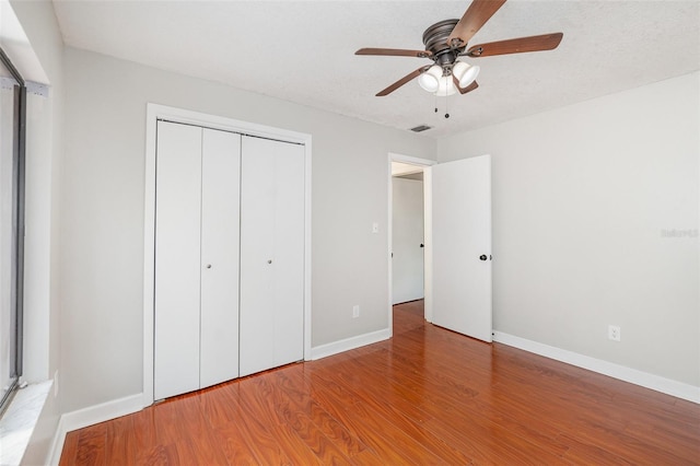 917 Great Bend Rd, Altamonte Springs, FL 32714 - unfurnished bedroom featuring a closet, wood finished floors, and ceiling fan