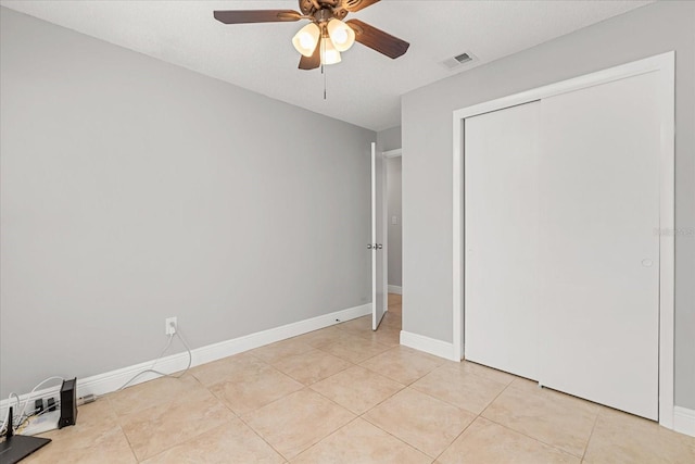 1346 Palo Alto Ct, Winter Springs, FL 32708 - unfurnished bedroom with a closet, light tile patterned floors, and a ceiling fan