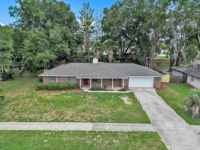 5460 SE 28th St, Ocala, FL 34480 - ranch-style home featuring brick siding, an attached garage, driveway, a porch, and a chimney
