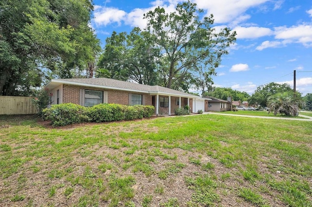 5460 SE 28th St, Ocala, FL 34480 - ranch-style home with a garage, brick siding, and driveway