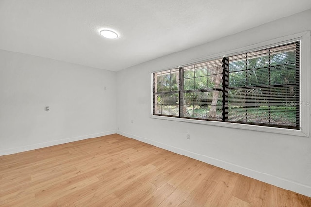 5460 SE 28th St, Ocala, FL 34480 - unfurnished room with healthy amount of natural light and light wood finished floors