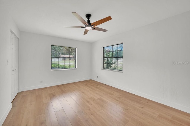 5460 SE 28th St, Ocala, FL 34480 - empty room with healthy amount of natural light, light wood-style flooring, and ceiling fan