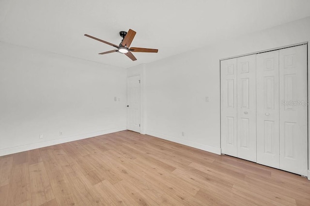 5460 SE 28th St, Ocala, FL 34480 - unfurnished bedroom with light wood-style floors, ceiling fan, and a closet
