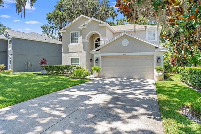 1785 Rushden Dr, Ocoee, FL 34761 - traditional home featuring stucco siding, an attached garage, a front yard, and driveway