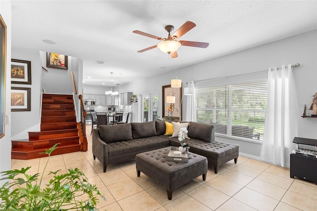 1785 Rushden Dr, Ocoee, FL 34761 - living area with stairs, light tile patterned floors, ceiling fan, and a textured ceiling