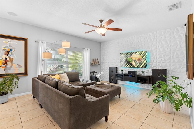 1785 Rushden Dr, Ocoee, FL 34761 - living area featuring ceiling fan, light tile patterned floors, and a textured ceiling