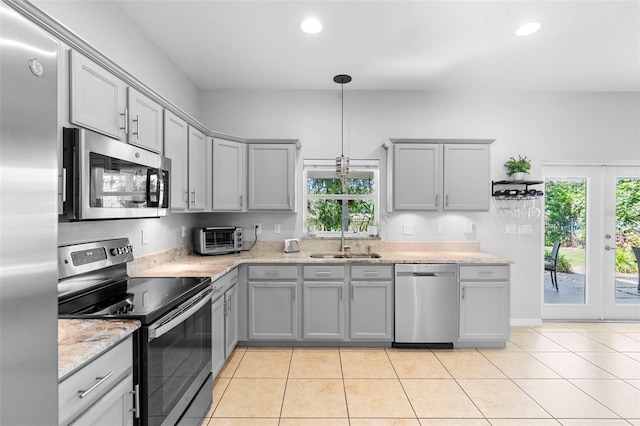 1785 Rushden Dr, Ocoee, FL 34761 - kitchen featuring stainless steel appliances, gray cabinetry, recessed lighting, and light tile patterned floors