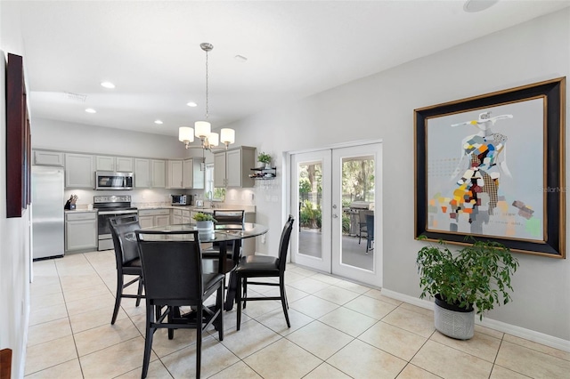 1785 Rushden Dr, Ocoee, FL 34761 - dining room featuring a chandelier, french doors, light tile patterned floors, and recessed lighting