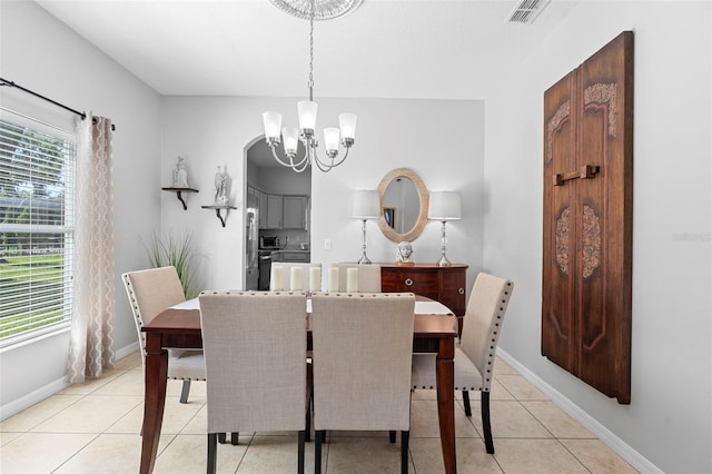 1785 Rushden Dr, Ocoee, FL 34761 - dining area with a chandelier and light tile patterned flooring