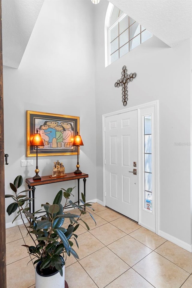1785 Rushden Dr, Ocoee, FL 34761 - tiled foyer featuring a high ceiling and baseboards